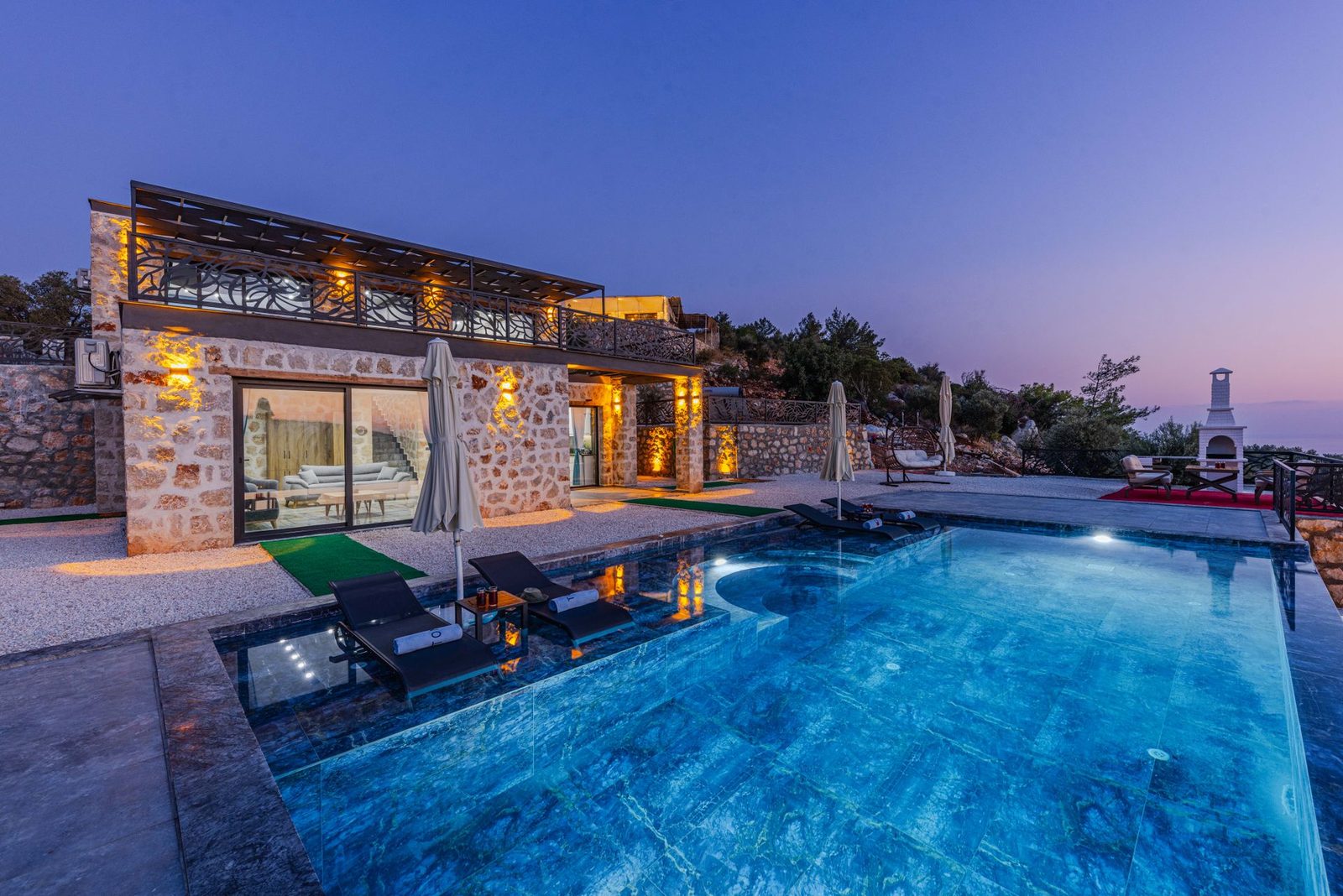 Evening lighting reflecting across a long pool — design inspiration